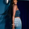 Jeans bootcut a vita bassa con lavaggio medio e motivi floreali ricamati