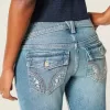 Jeans bootcut a vita bassa con lavaggio medio e motivi floreali ricamati