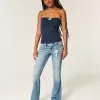Jeans bootcut a vita bassa con lavaggio medio e motivi floreali ricamati