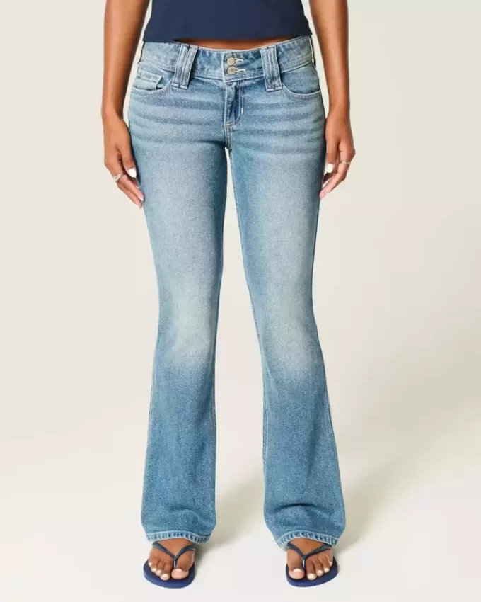 Jeans bootcut a vita bassa con lavaggio medio e motivi floreali ricamati