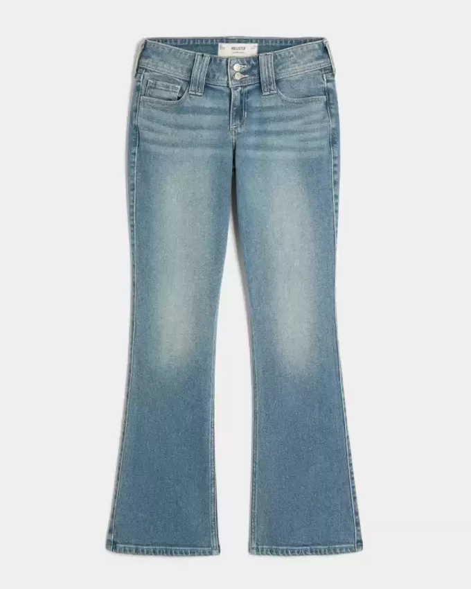 Jeans bootcut a vita bassa con lavaggio medio e motivi floreali ricamati