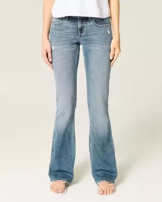Jeans bootcut a vita bassa con lavaggio medio effetto consumato