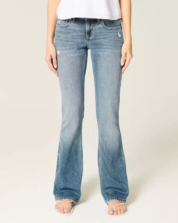 Jeans bootcut a vita bassa con lavaggio medio effetto consumato