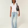 Jeans bootcut a vita bassa con ricamo a farfalla e lavaggio medio