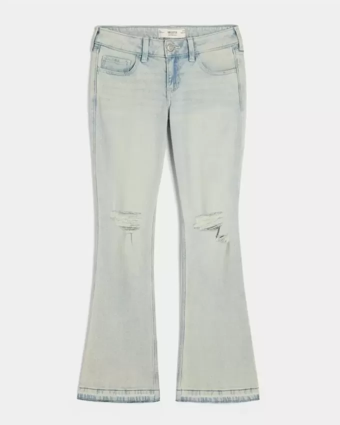 Jeans bootcut a vita bassa con strappi e lavaggio chiaro Jeans bootcut a vita bassa con strappi e lavaggio chiaro
