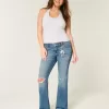 Jeans bootcut a vita bassa con strappi e lavaggio medio