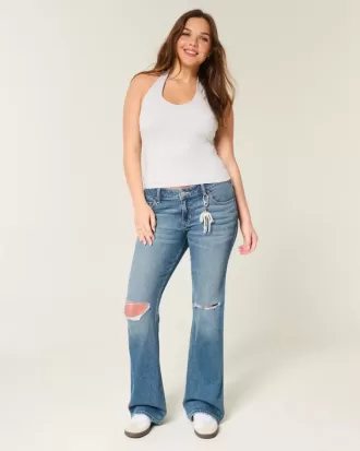 Jeans bootcut a vita bassa con strappi e lavaggio medio