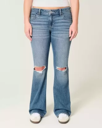 Jeans bootcut a vita bassa con strappi e lavaggio medio