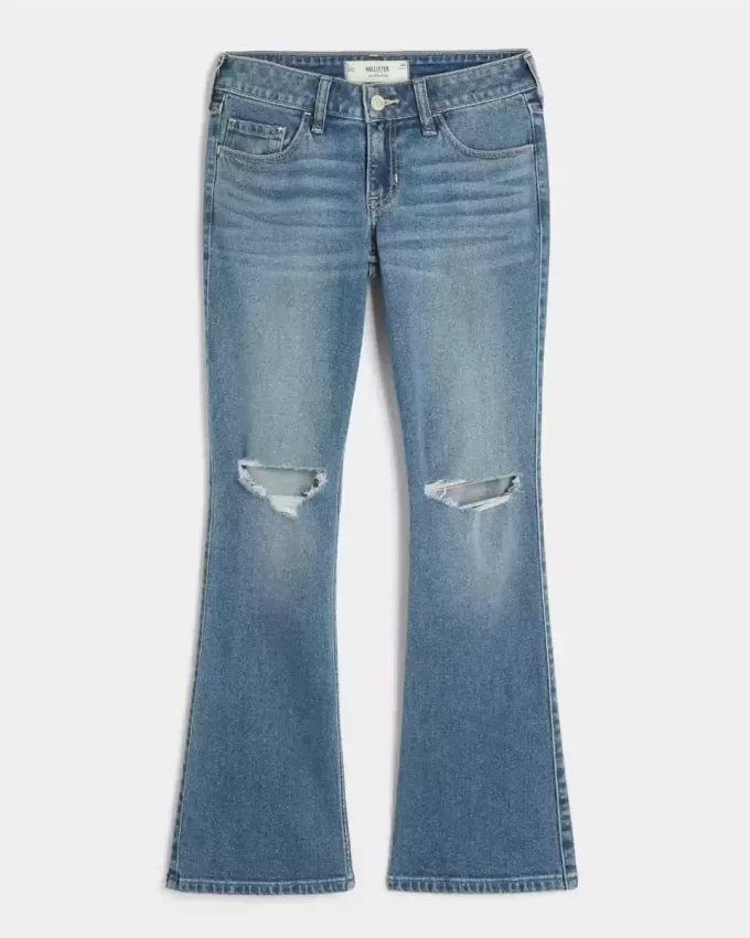 Jeans bootcut a vita bassa con strappi e lavaggio medio