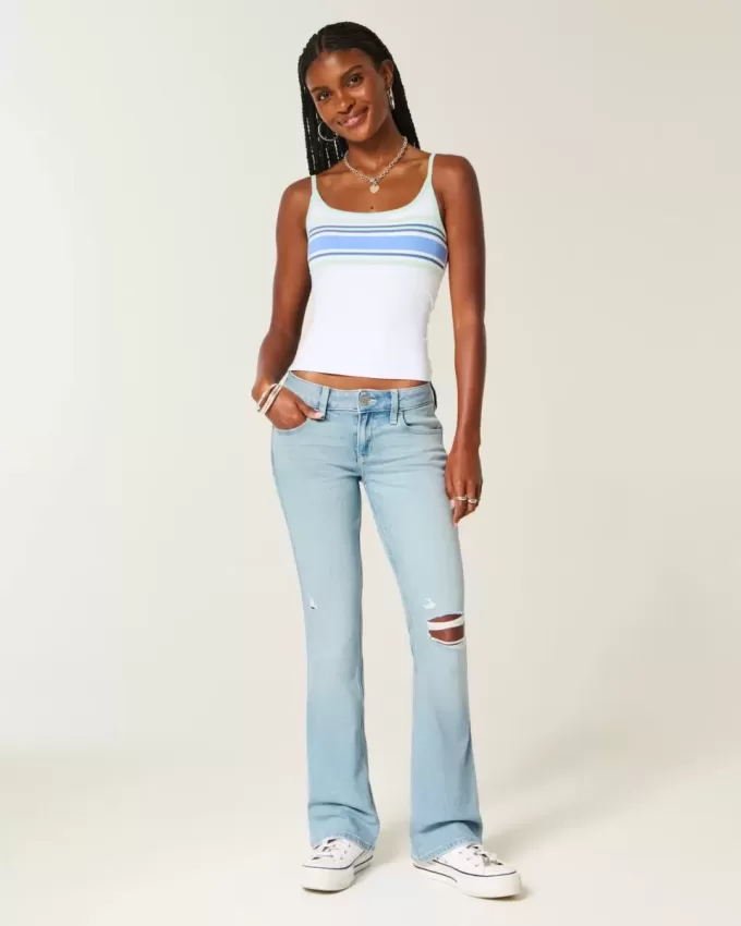 Jeans bootcut a vita bassa, strappati, lavaggio chiaro e ricamati