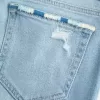 Jeans bootcut a vita bassa, strappati, lavaggio chiaro e ricamati