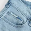 Jeans bootcut a vita bassa, strappati, lavaggio chiaro e ricamati