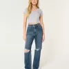 Jeans da papà strappati a vita altissima e lavaggio scuro