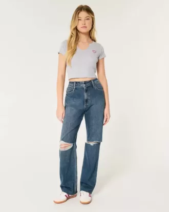 Jeans da papà strappati a vita altissima e lavaggio scuro
