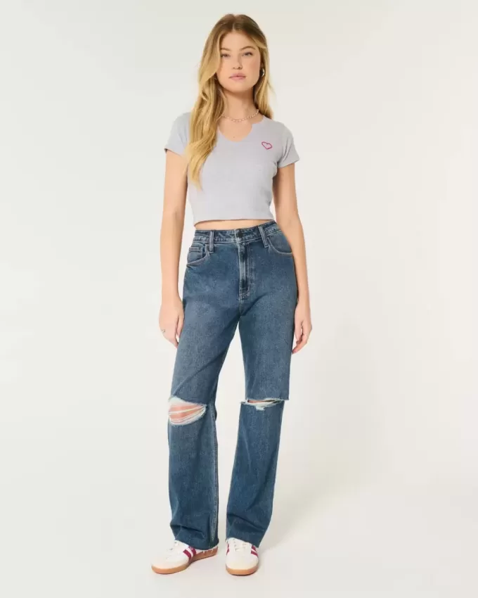 Jeans da papà strappati a vita altissima e lavaggio scuro
