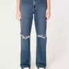 Jeans da papà strappati a vita altissima e lavaggio scuro