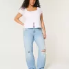 Jeans dritti e rilassati con lavaggio chiaro e strappi a vita bassa