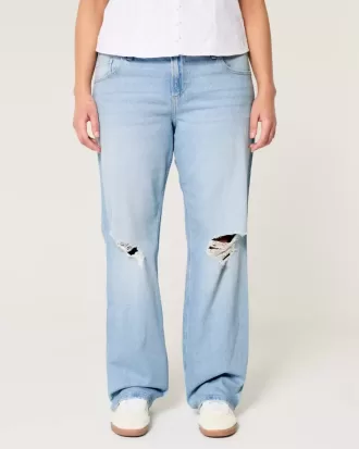 Jeans dritti e rilassati con lavaggio chiaro e strappi a vita bassa