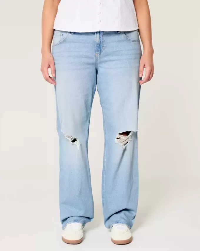 Jeans dritti e rilassati con lavaggio chiaro e strappi a vita bassa