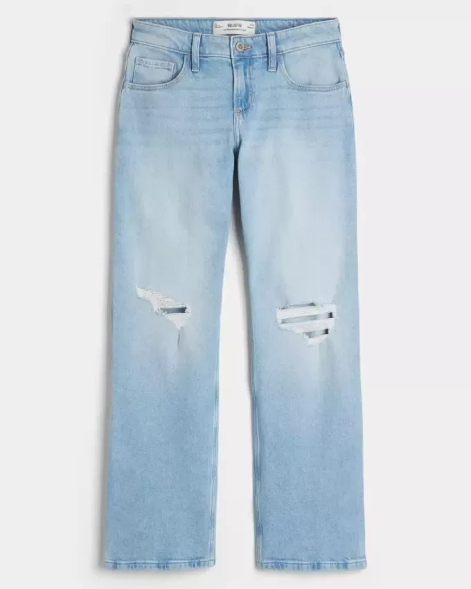 Jeans dritti e rilassati con lavaggio chiaro e strappi a vita bassa