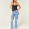 Jeans dritti e rilassati con lavaggio medio e strappi a vita bassa