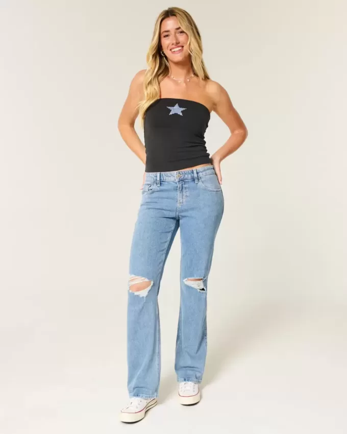 Jeans dritti e rilassati con lavaggio medio e strappi a vita bassa