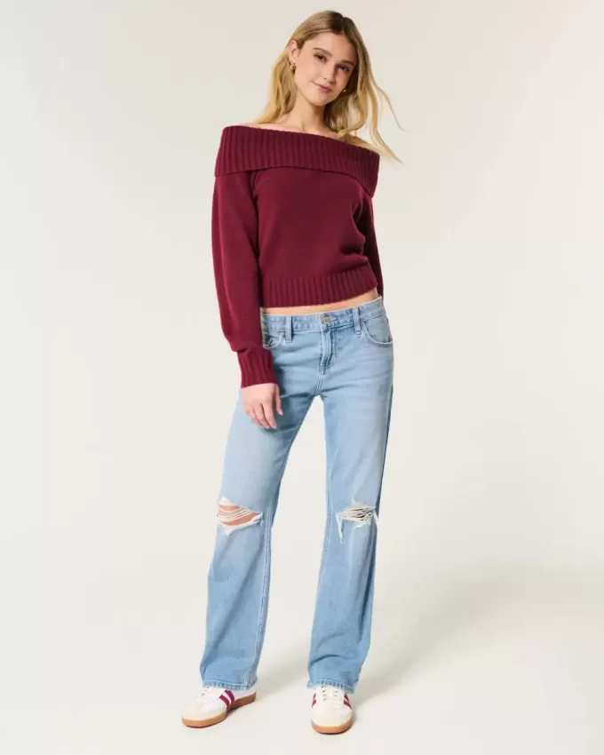 Jeans dritti e rilassati con lavaggio medio e strappi a vita bassa