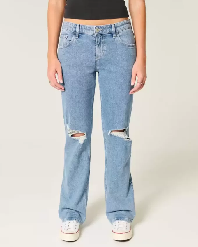 Jeans dritti e rilassati con lavaggio medio e strappi a vita bassa