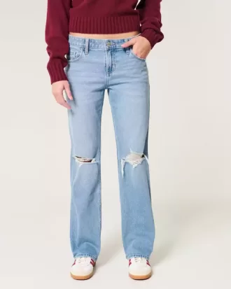 Jeans dritti e rilassati con lavaggio medio e strappi a vita bassa