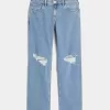 Jeans dritti e rilassati con lavaggio medio e strappi a vita bassa