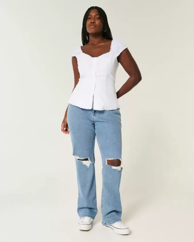 Jeans dritti e rilassati con lavaggio medio e vita bassa e strappi curvy
