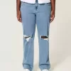 Jeans dritti e rilassati con lavaggio medio e vita bassa e strappi curvy