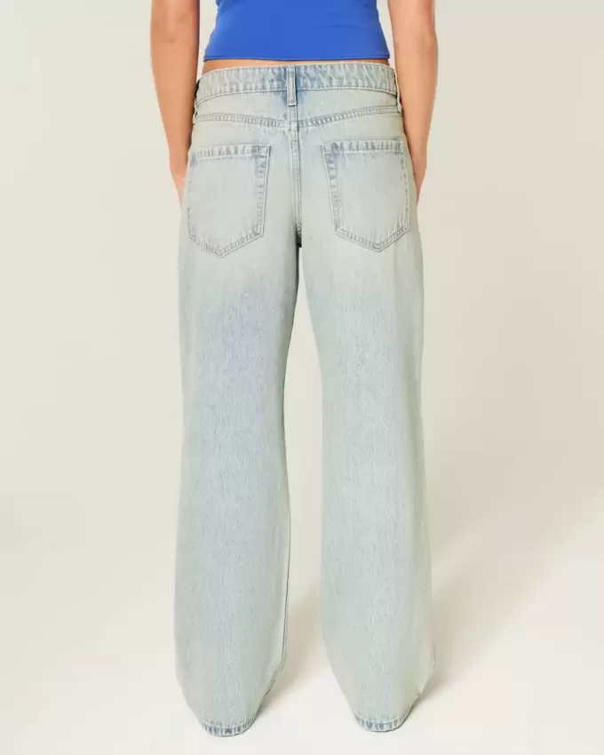 Jeans larghi a vita alta con lavaggio chiaro effetto consumato
