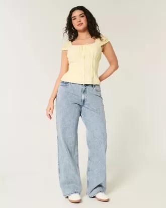 Jeans larghi a vita alta e lavaggio medio con effetto curvy