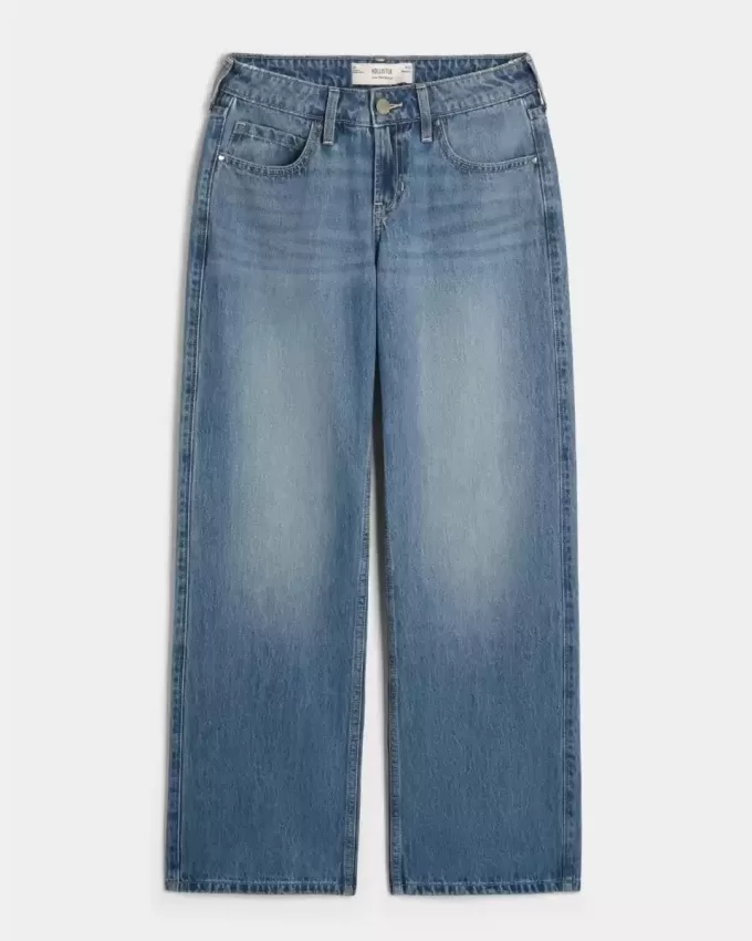 Jeans larghi a vita bassa con cuori borchiati e lavaggio medio