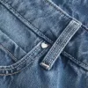 Jeans larghi a vita bassa con cuori borchiati e lavaggio medio