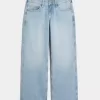 Jeans larghi a vita bassa con fiocchi borchiati e lavaggio chiaro