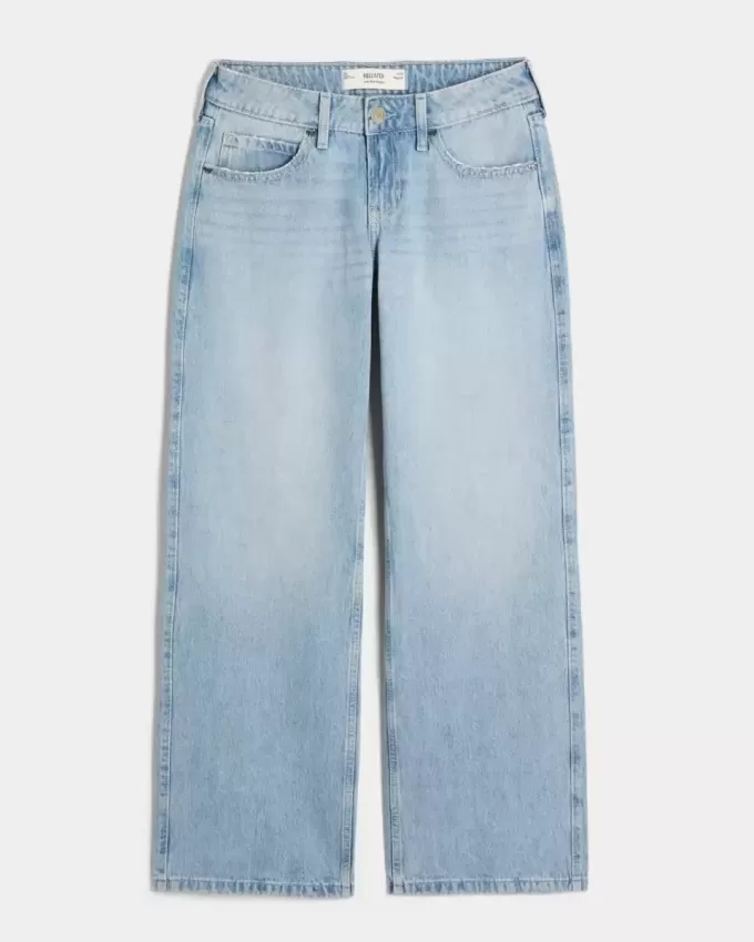 Jeans larghi a vita bassa con fiocchi borchiati e lavaggio chiaro