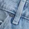 Jeans larghi a vita bassa con fiocchi borchiati e lavaggio chiaro