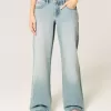 Jeans larghi a vita bassa con lavaggio chiaro