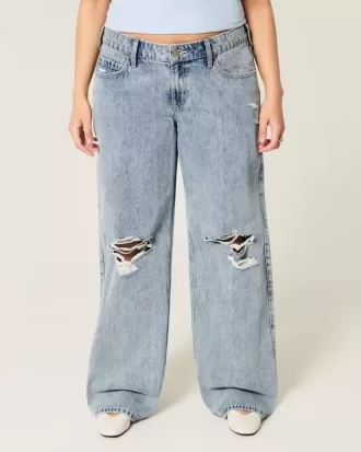 Jeans larghi a vita bassa con lavaggio medio e strappi