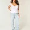 Jeans larghi a vita bassa con ricamo a stella e lavaggio chiaro