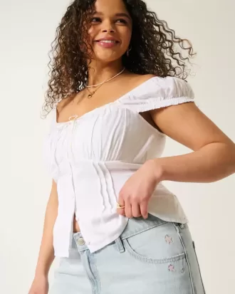 Jeans larghi a vita bassa con ricamo a stella e lavaggio chiaro