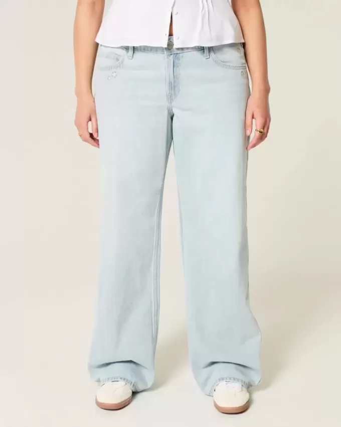 Jeans larghi a vita bassa con ricamo a stella e lavaggio chiaro