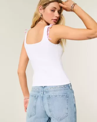 Jeans larghi a vita bassa con ricamo floreale e lavaggio medio