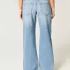 Jeans larghi a vita bassa con ricamo floreale e lavaggio medio