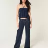 Jeans larghi a vita bassa con risvolto e lavaggio scuro