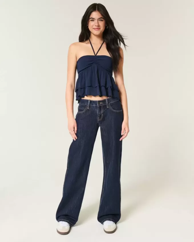 Jeans larghi a vita bassa con risvolto e lavaggio scuro