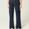 Jeans larghi a vita bassa con risvolto e lavaggio scuro