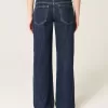 Jeans larghi a vita bassa con risvolto e lavaggio scuro